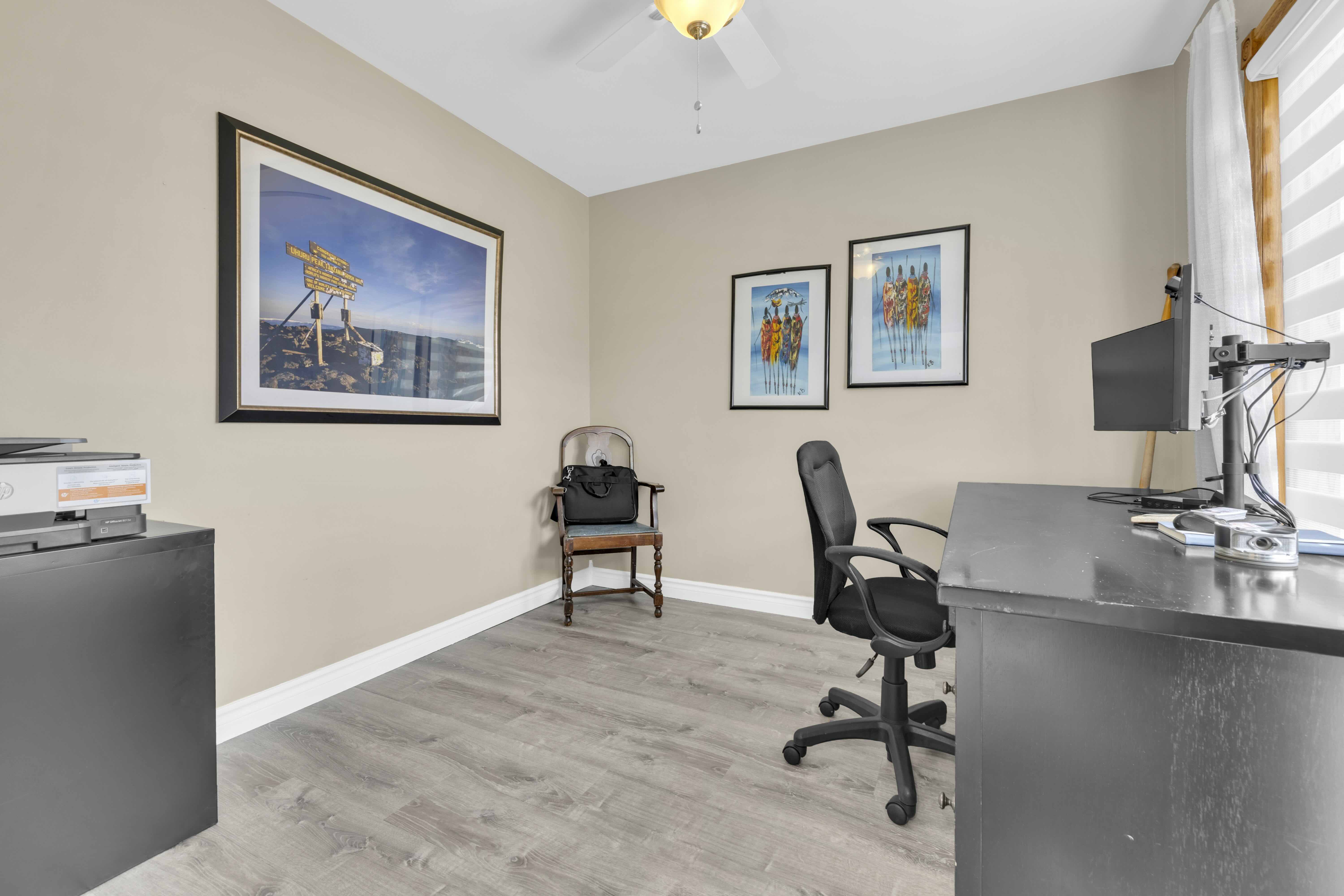 Home office / fourth bedroom with wood laminate flooring
