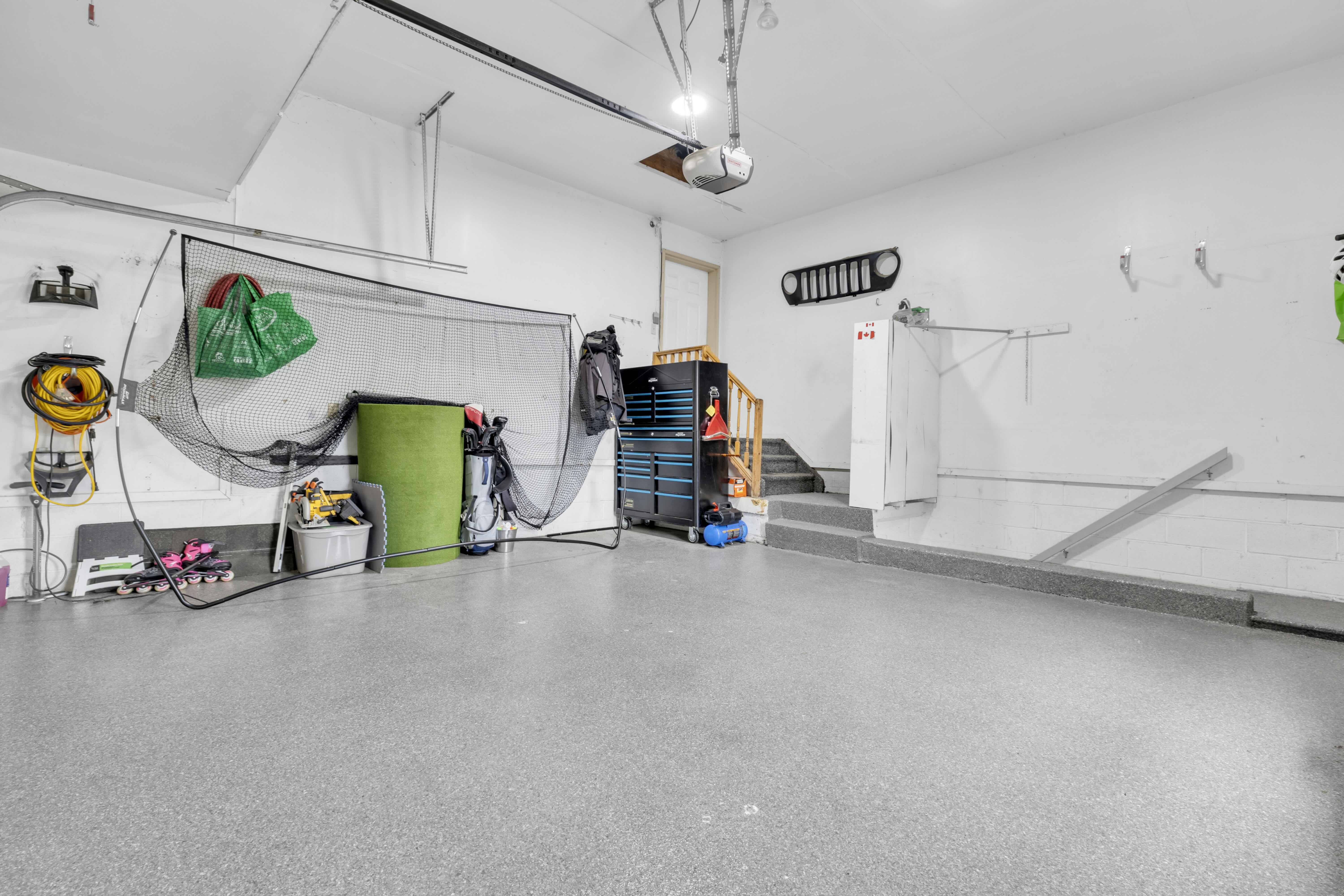 Garage interior with epoxy floor and storage