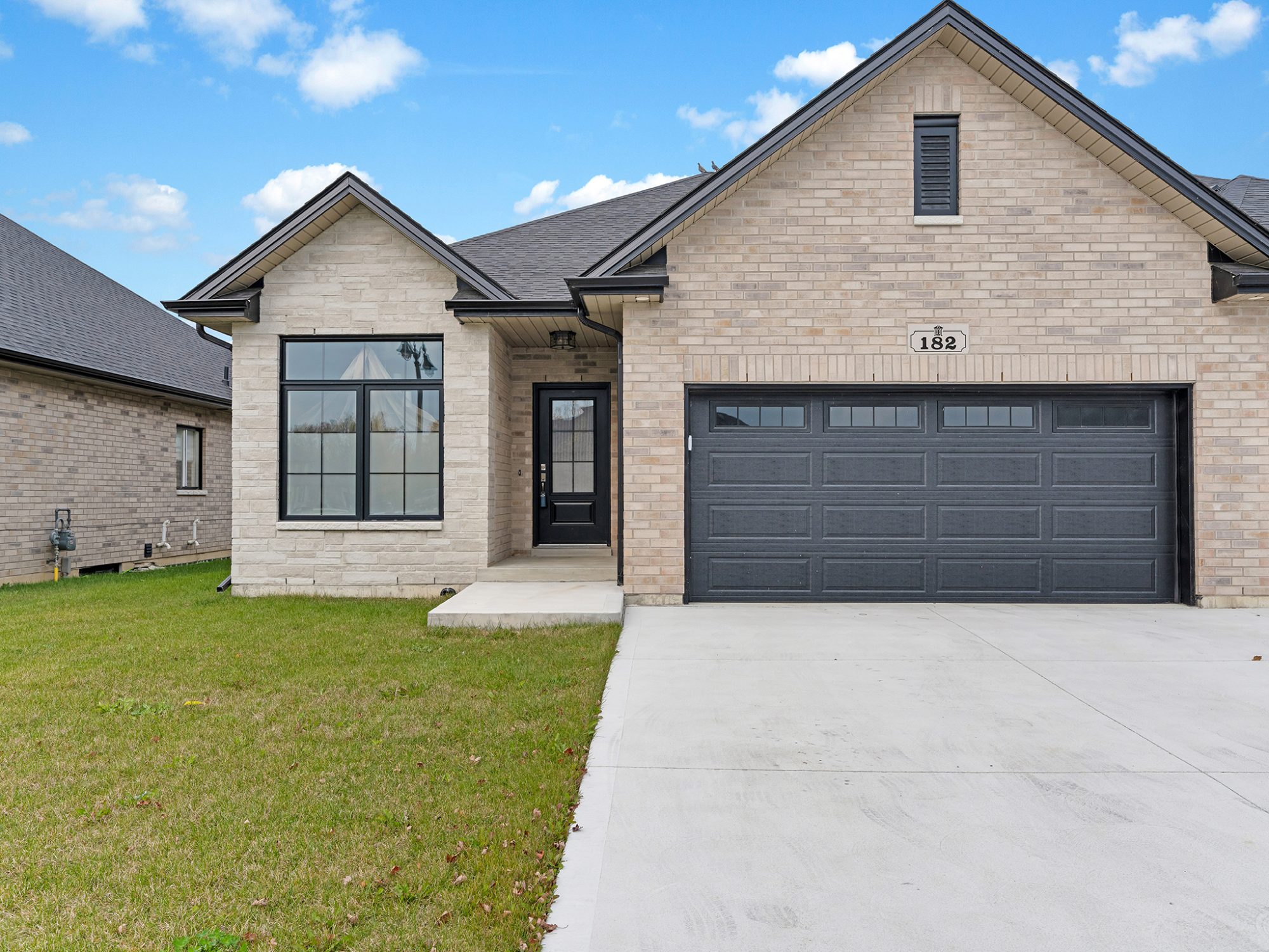 182 McLellan — full brick exterior under a clear sky