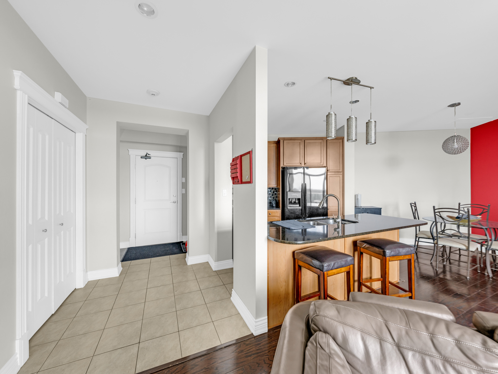 Open entryway flowing into kitchen and dining areas