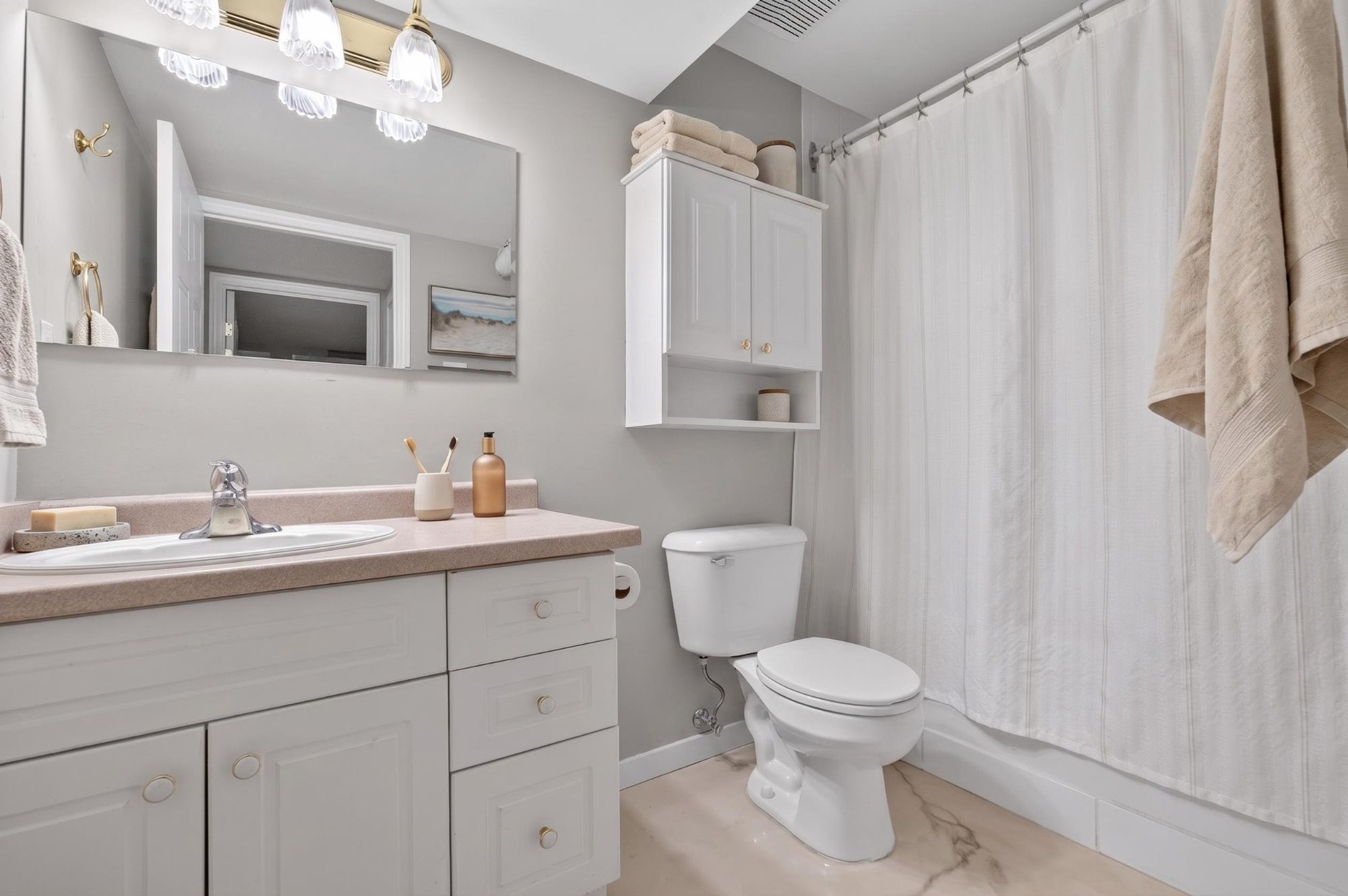 Lower level bathroom with vanity and shower