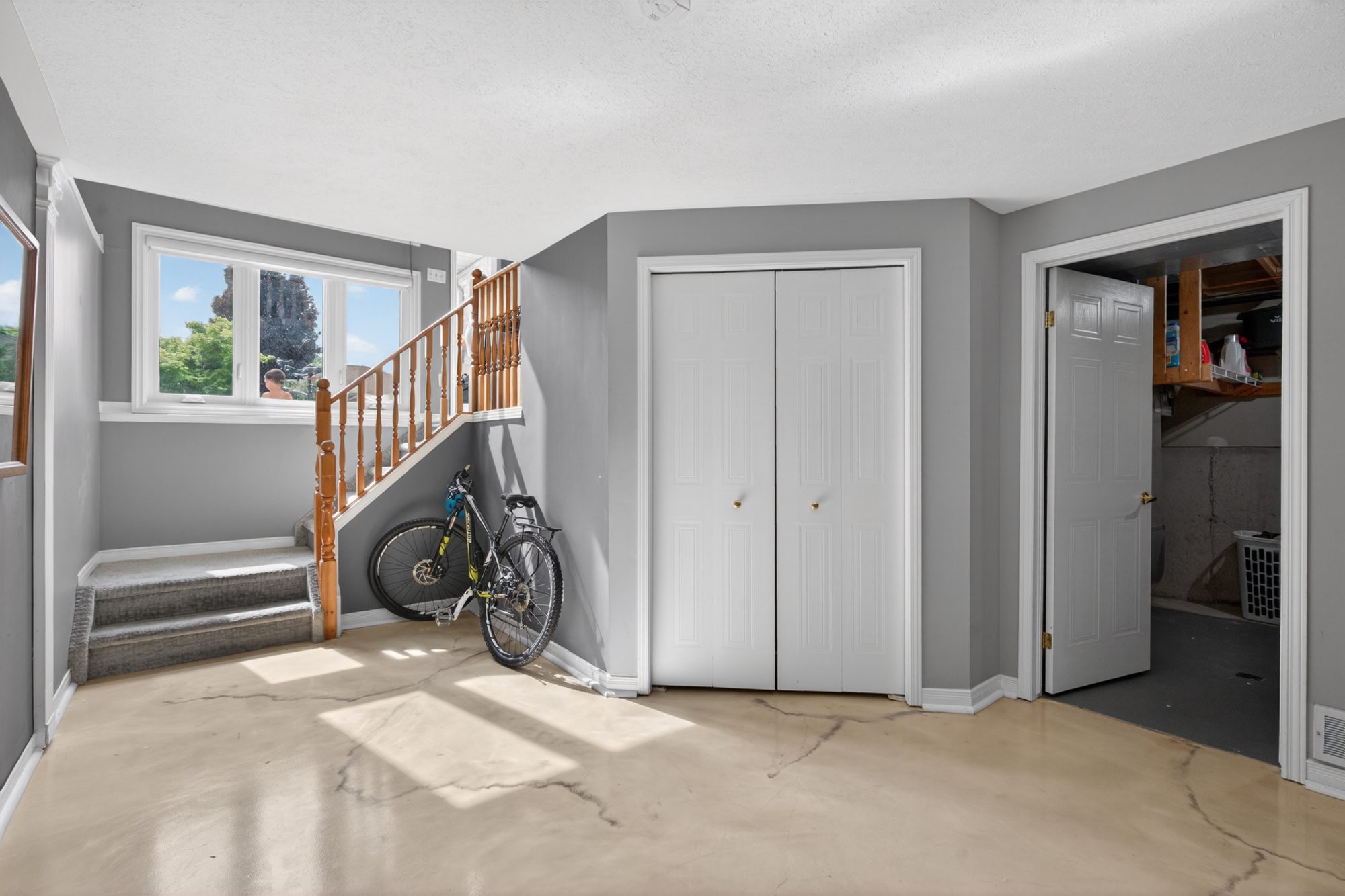 Basement area with stairs and closet