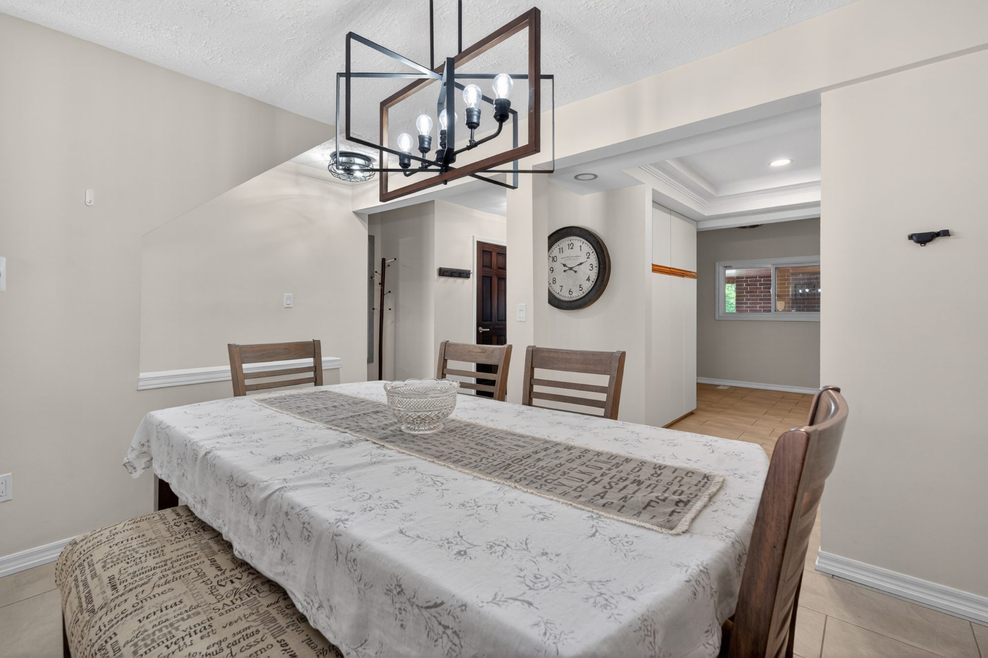Dining room with geometric chandelier