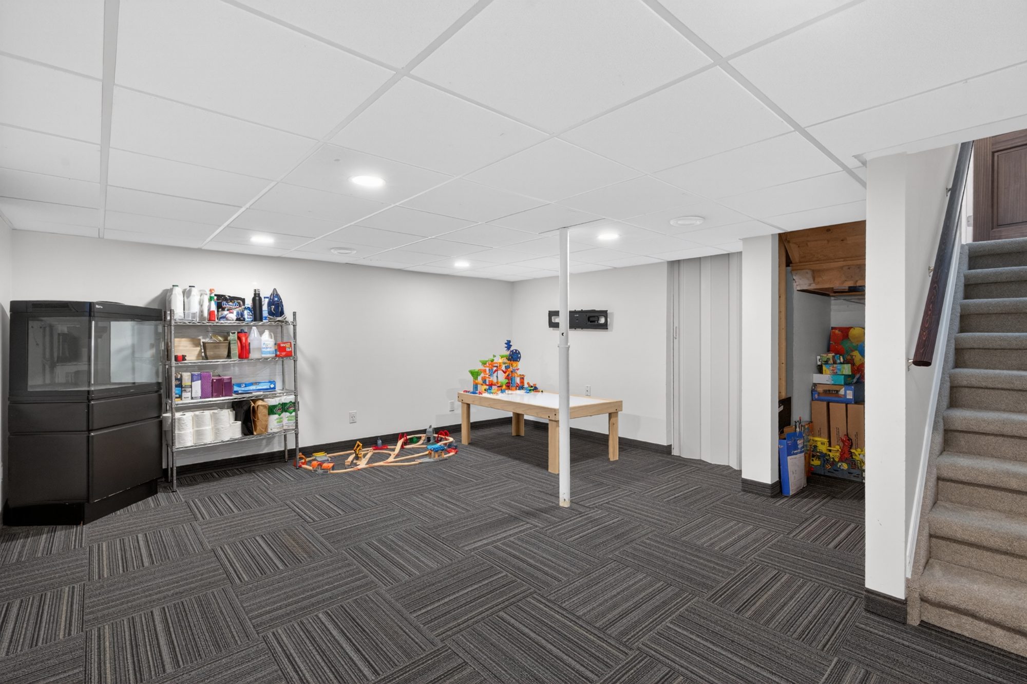 Finished basement with carpet and recessed lighting