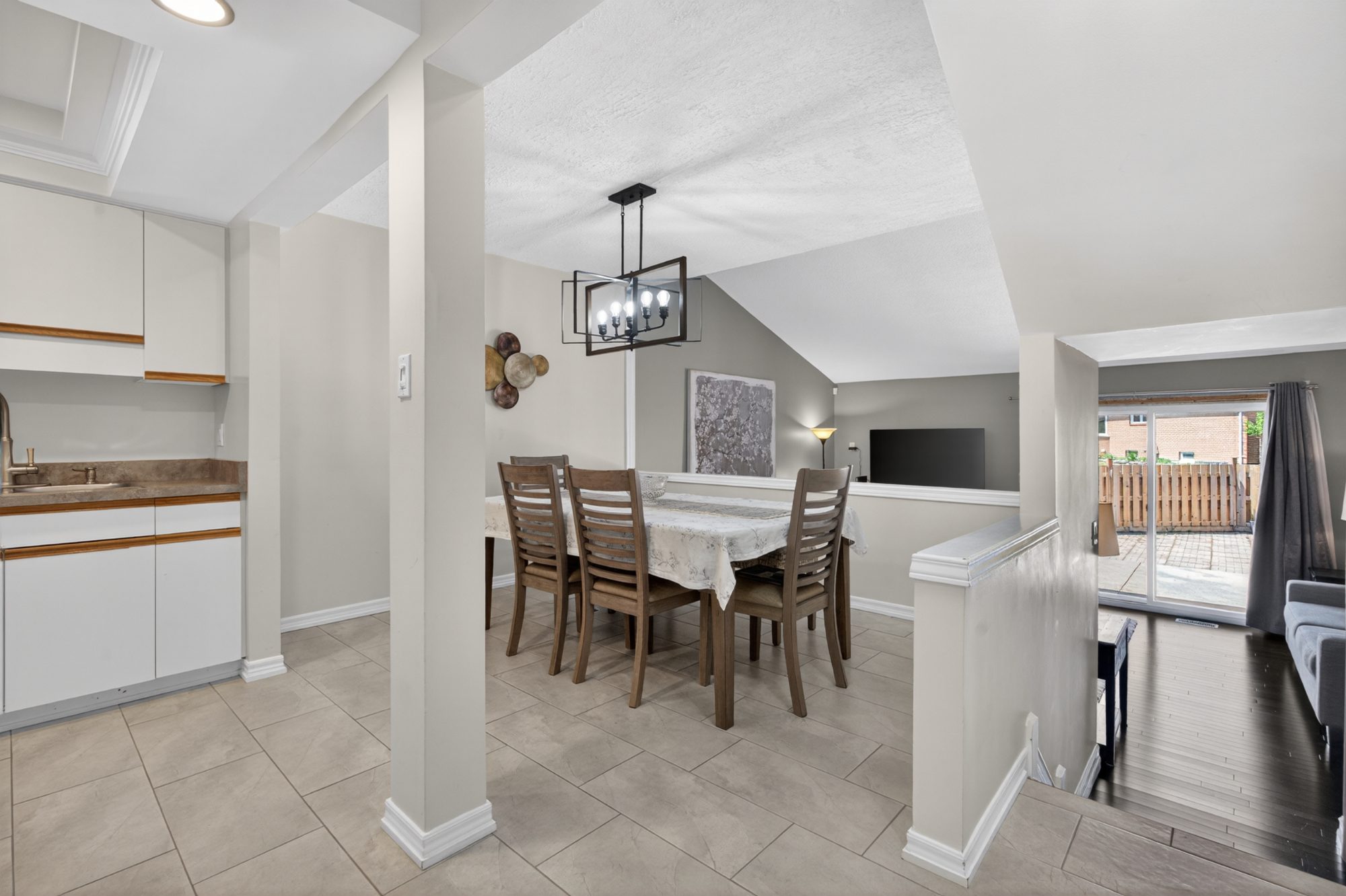Dining area with chandelier and sliding patio door view