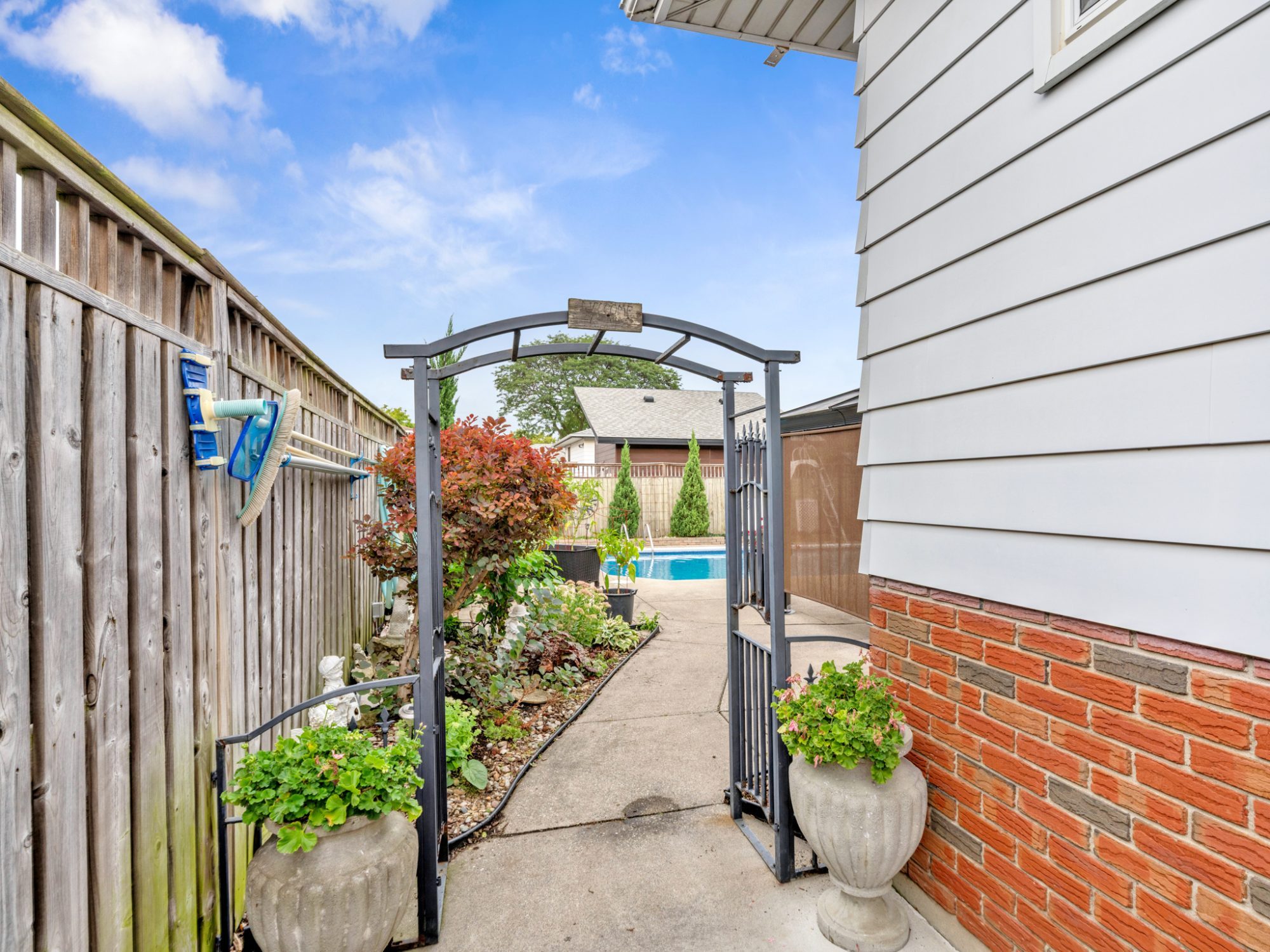 One of the two side gates, with the walkway to the backyard.