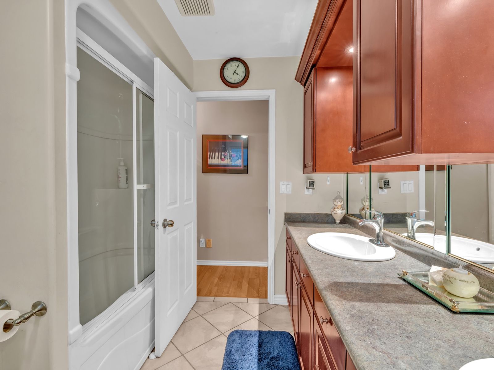 The 5-piece bath: long counter and tub with sliding glass doors.