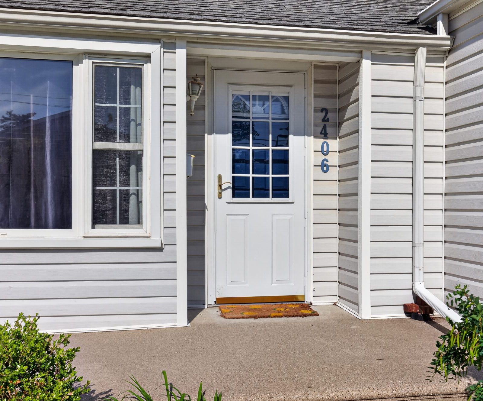 Front entrance door and house number 2406