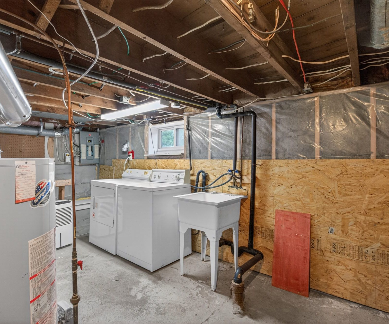 Laundry room with washer, dryer, and laundry sink