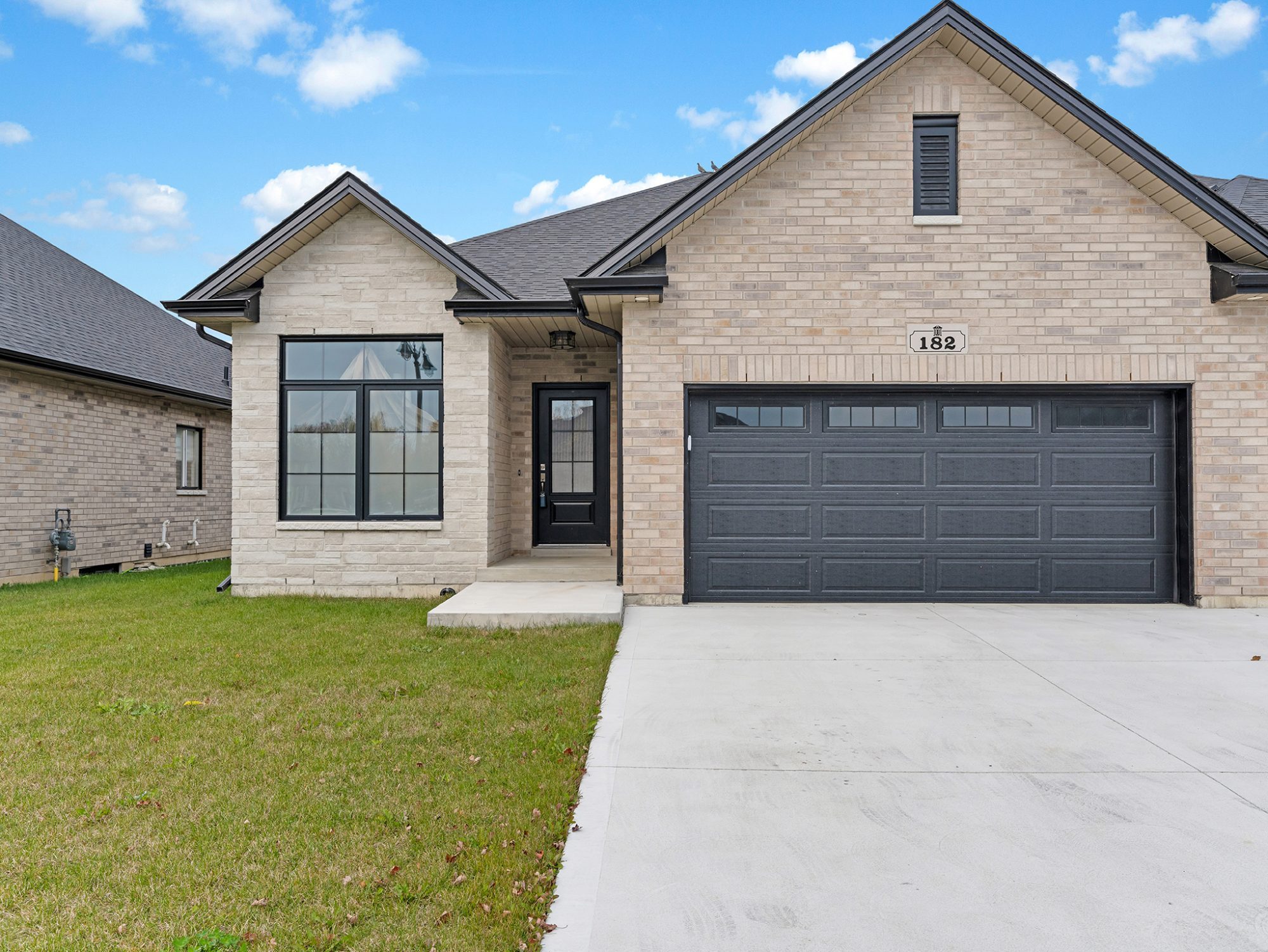 182 McLellan — full brick exterior under a clear sky