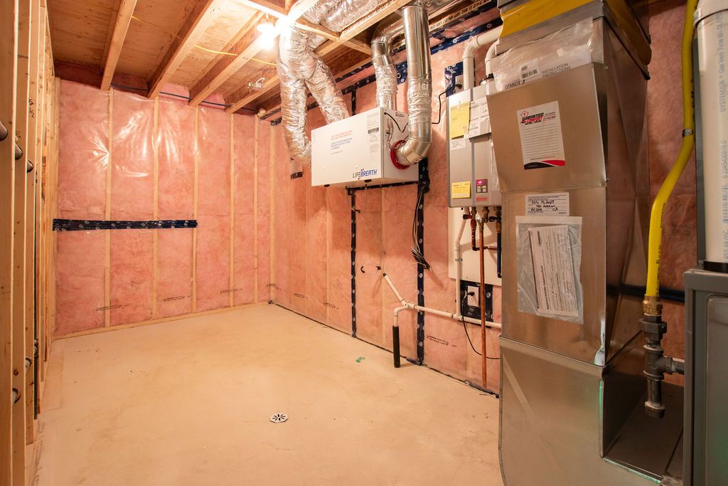 Unfinished utility area with HVAC