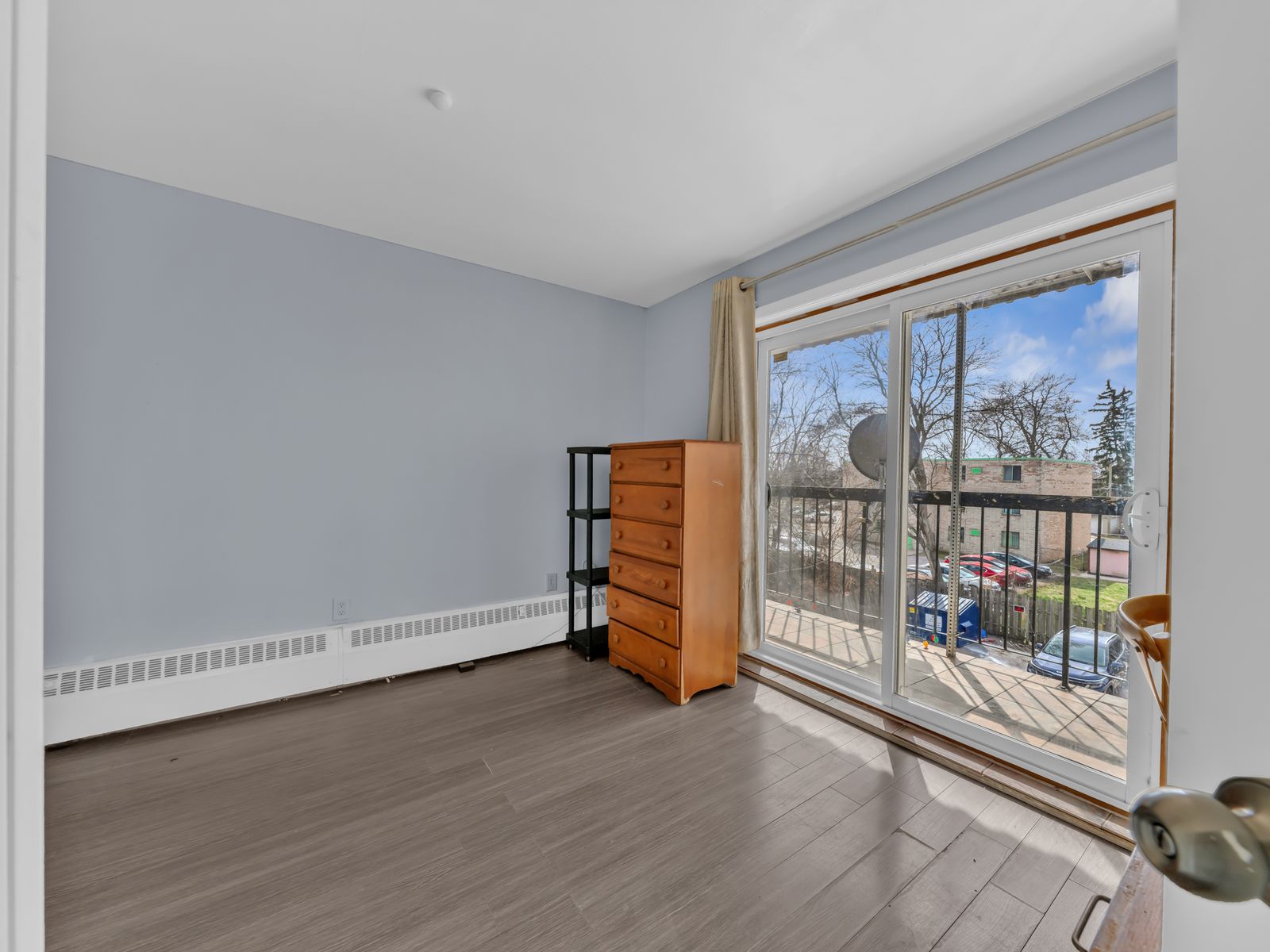 Bedroom with sliding glass door and outdoor view