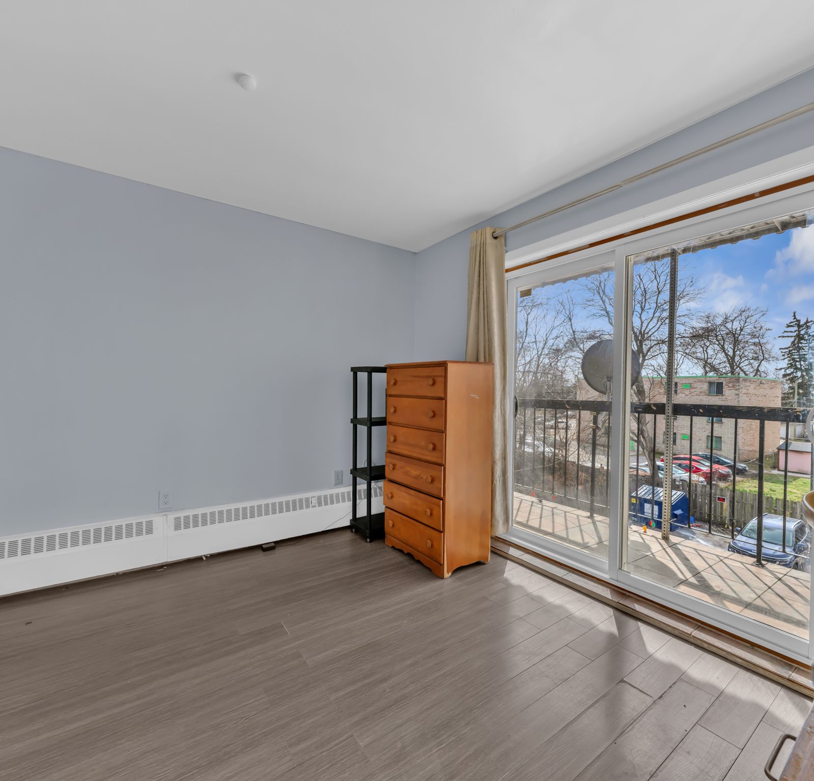 Bedroom with sliding glass door and outdoor view
