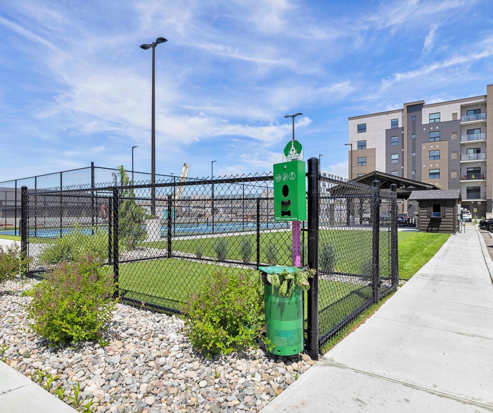 Pickleball courts with dog waste station and parking lot
