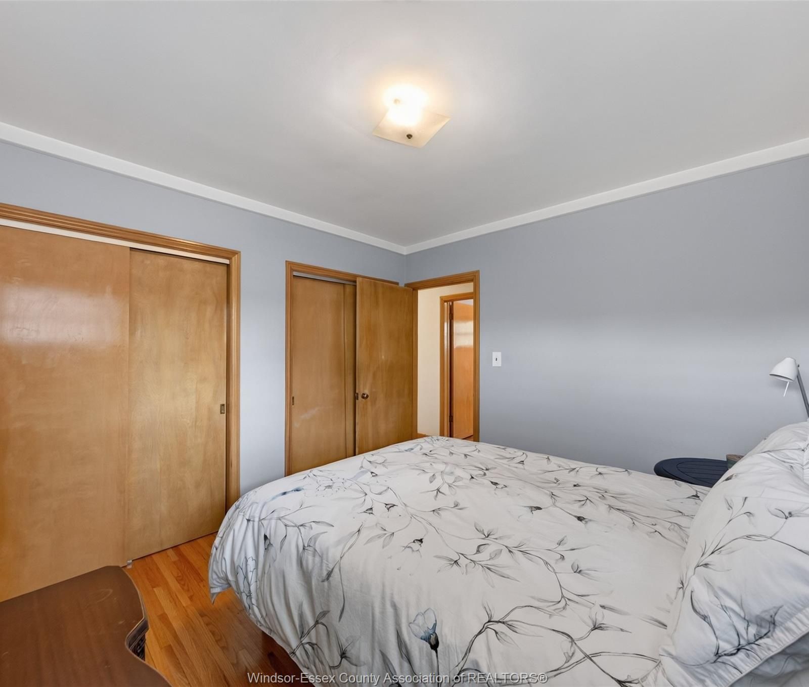 Bedroom with wood framed doors
