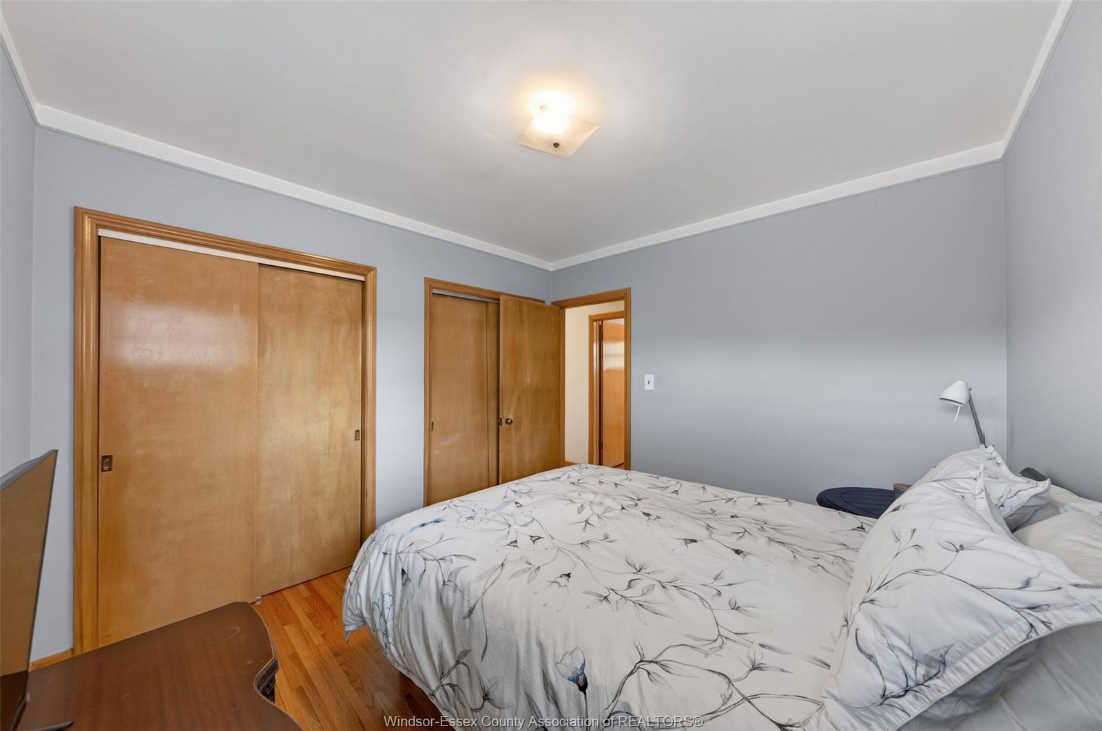 Bedroom with wood framed doors