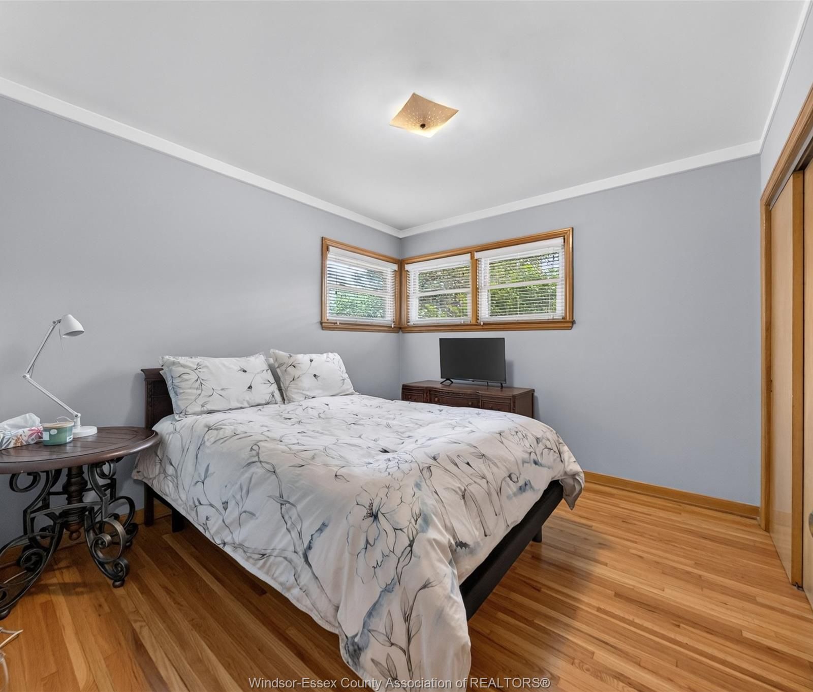 Primary bedroom with corner windows