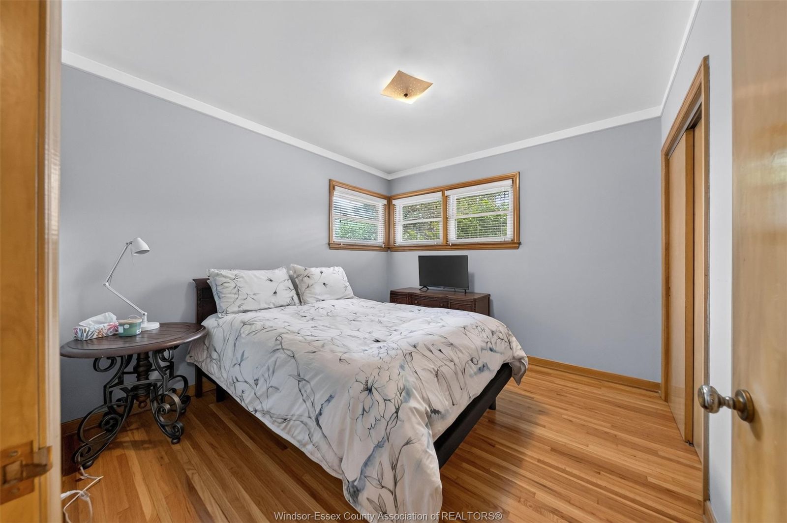 Primary bedroom with corner windows