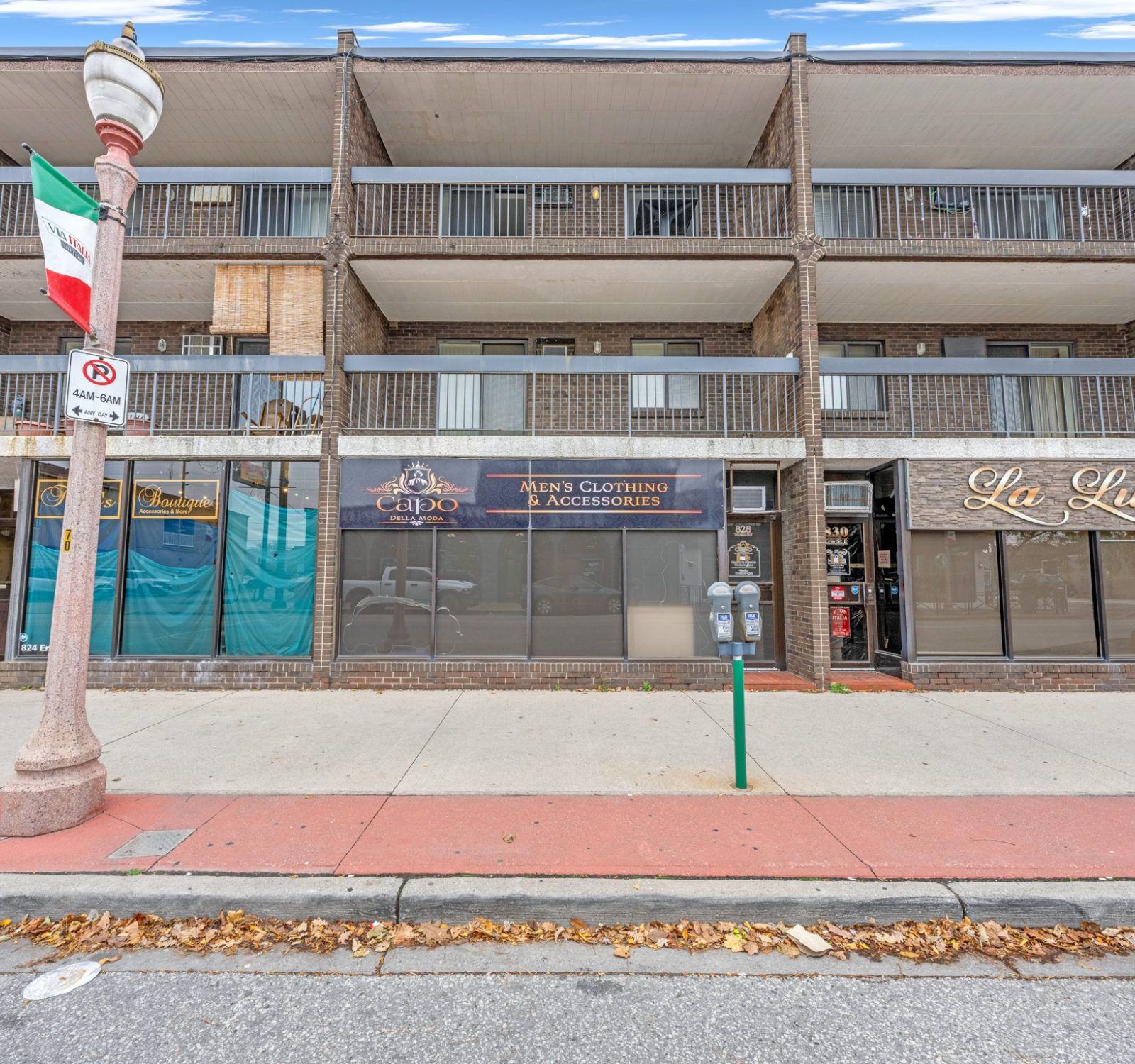 Front exterior of 828 Erie Street East — brick commercial building with large storefront windows
