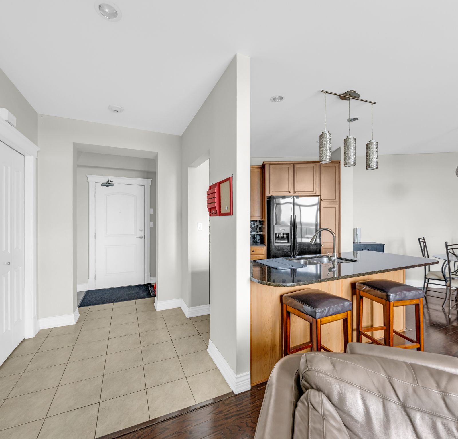Open entryway flowing into kitchen and dining areas