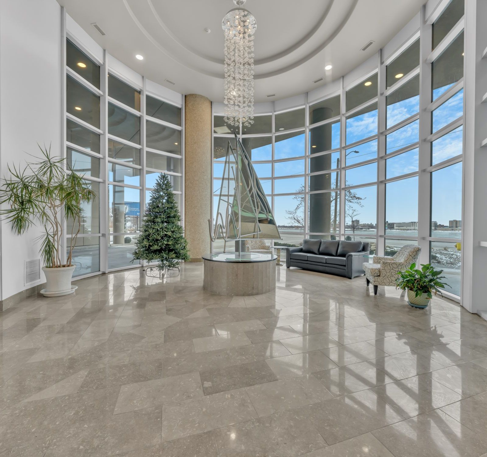 Grand lobby with chandelier and floor-to-ceiling windows