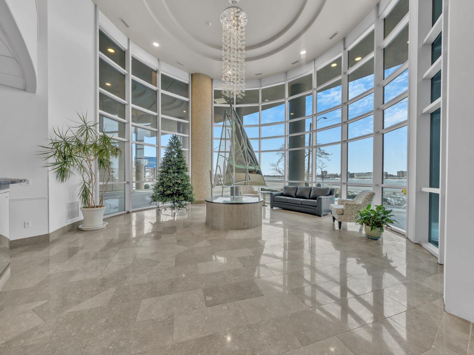 Grand lobby with chandelier and floor-to-ceiling windows