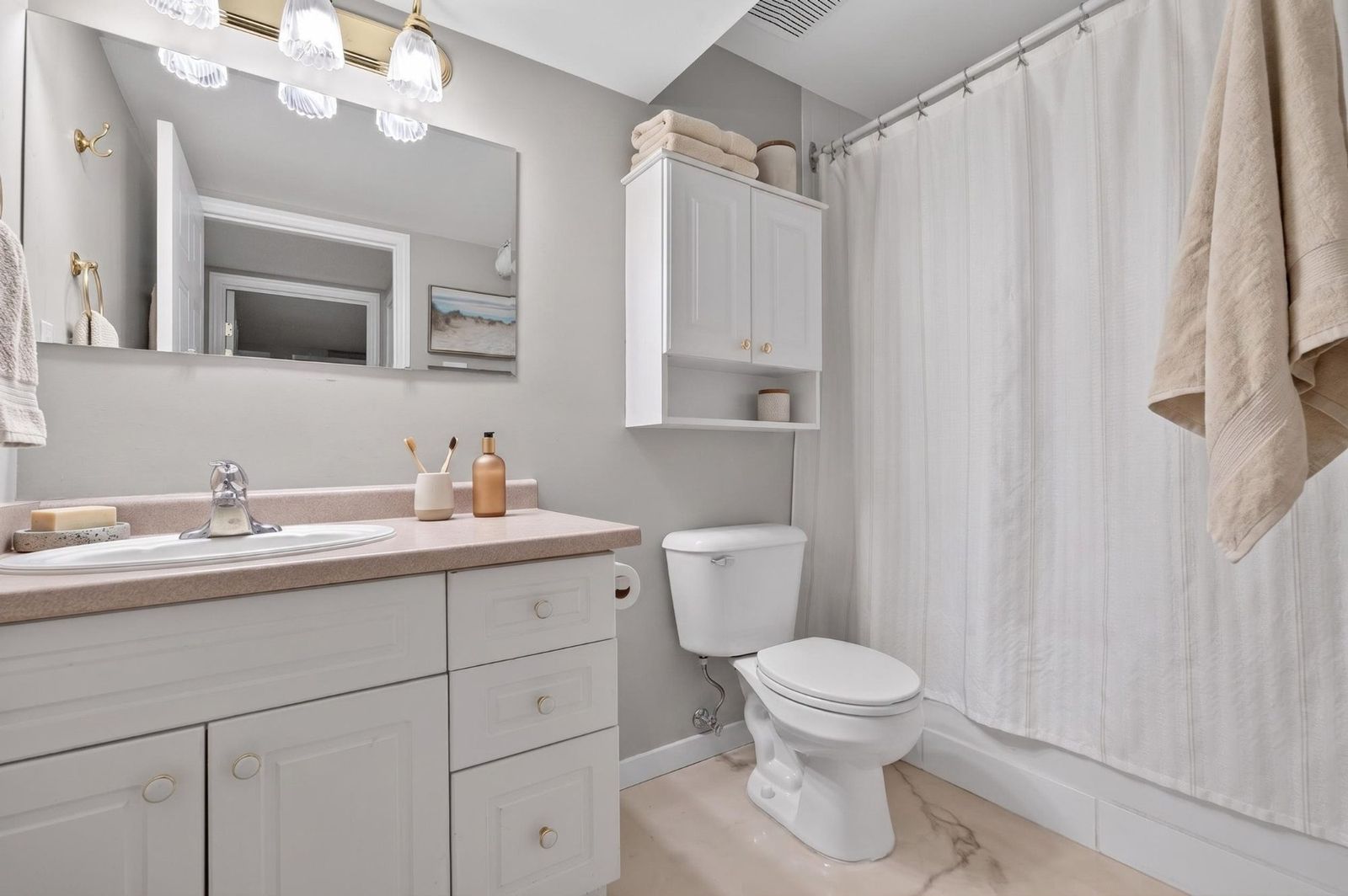 Lower level bathroom with vanity and shower