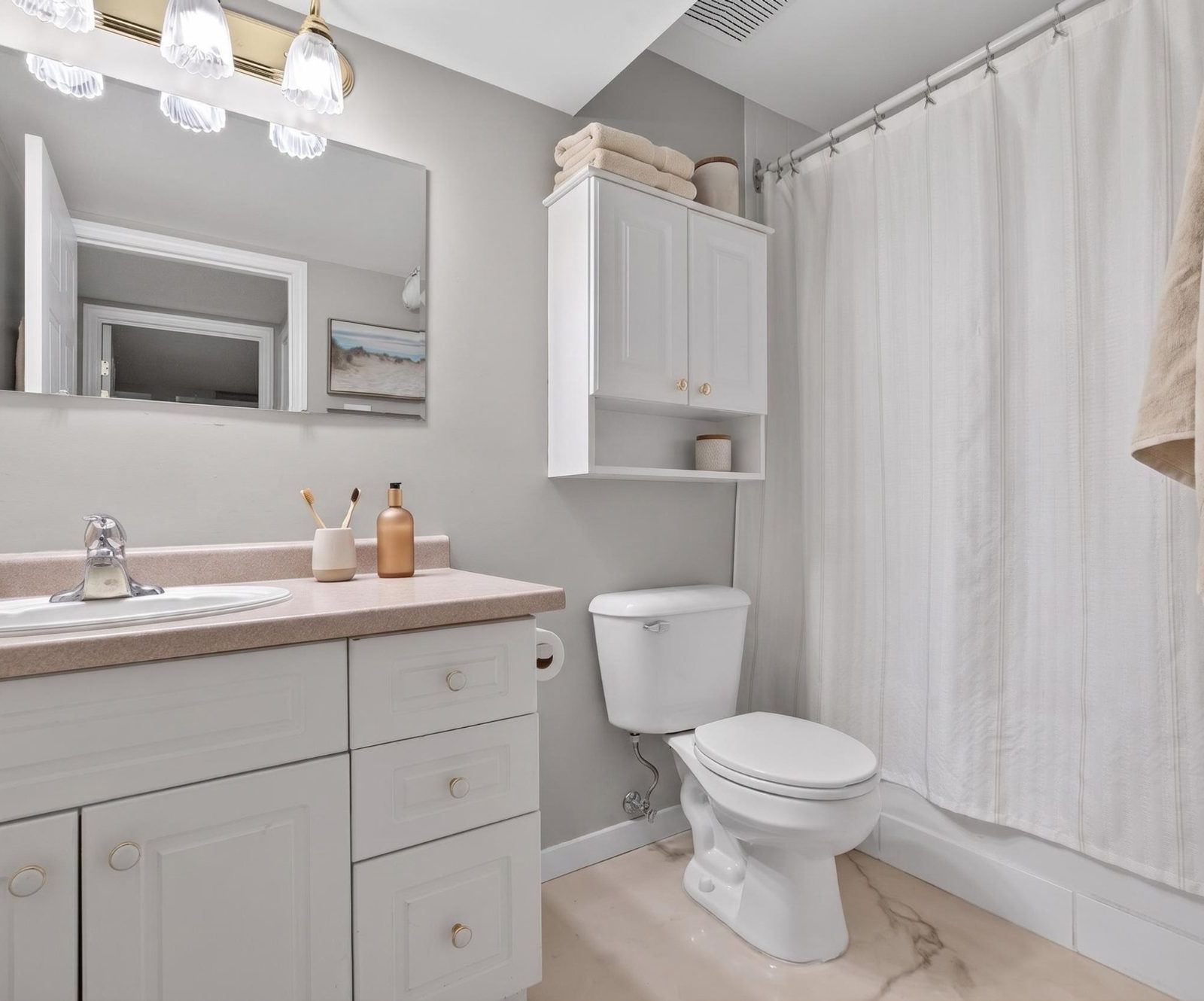 Lower level bathroom with vanity and shower