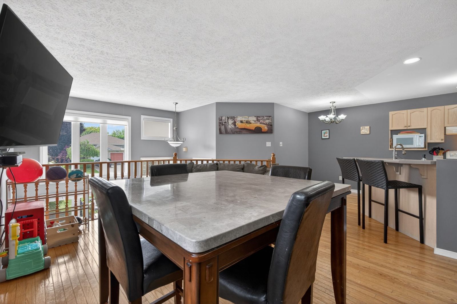 Dining room with marble top table and six chairs