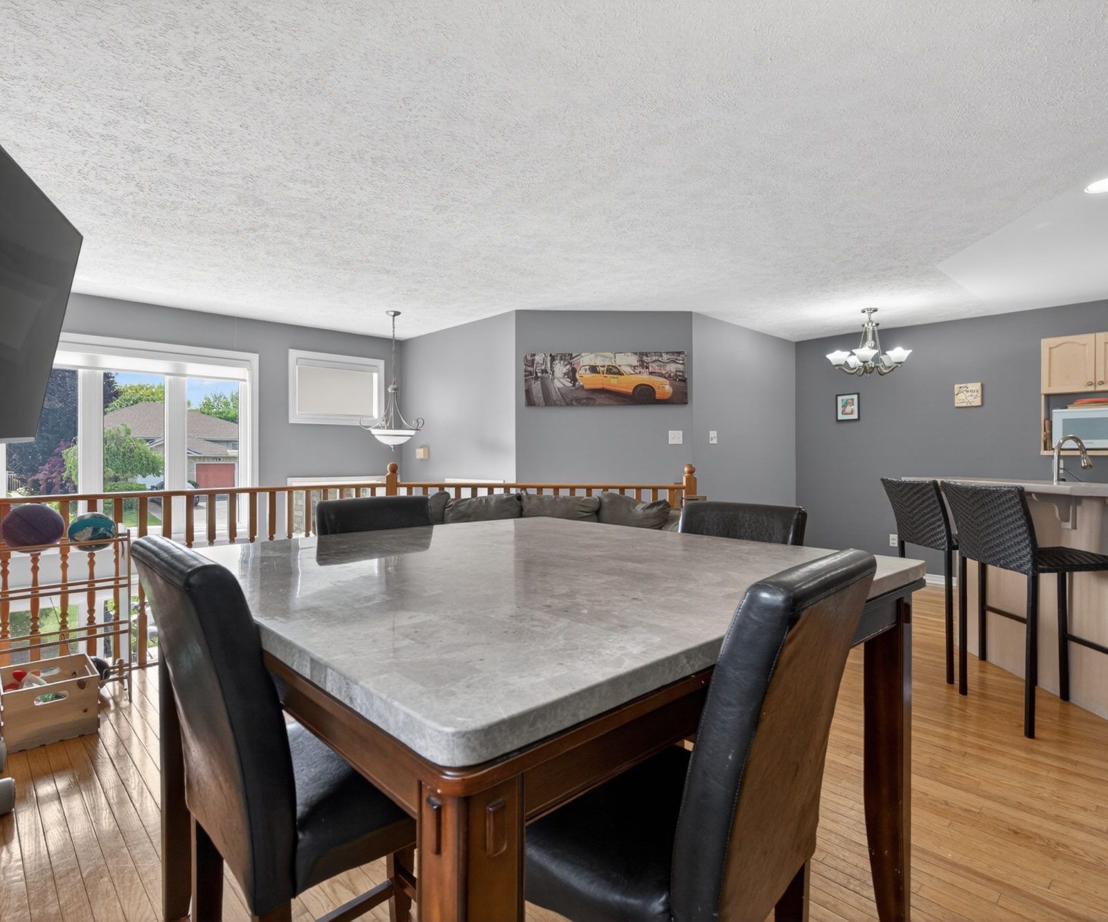 Dining room with marble top table and six chairs