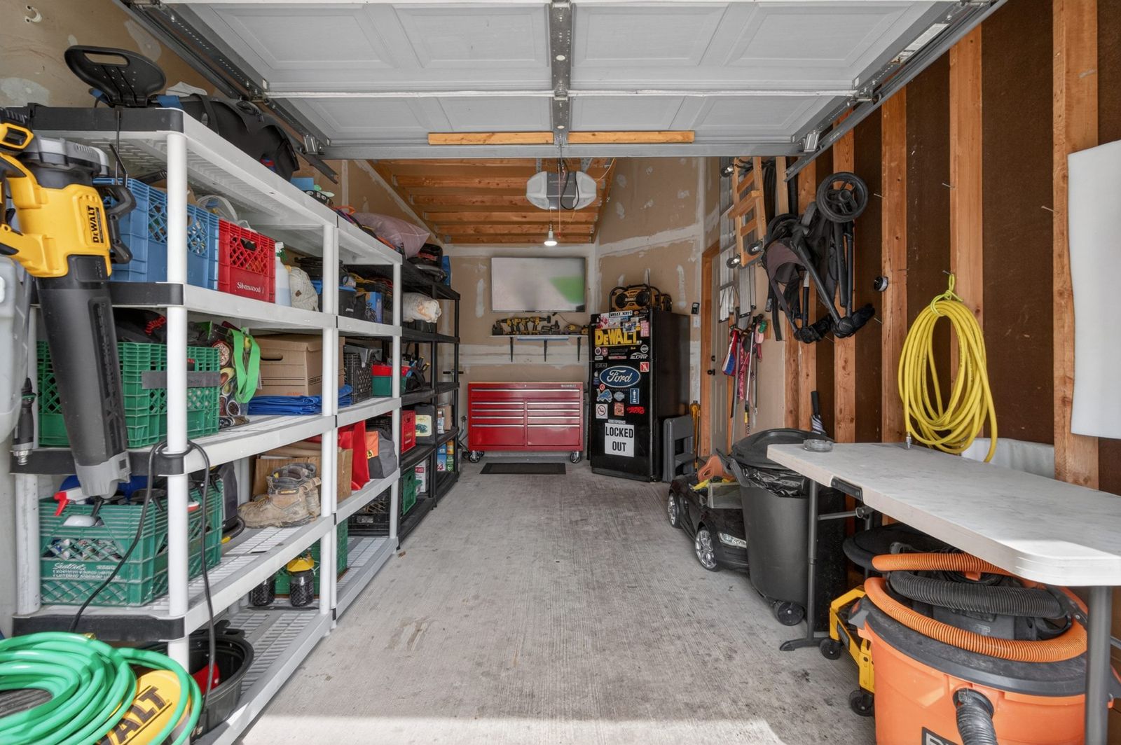 Organized garage with shelving and tools