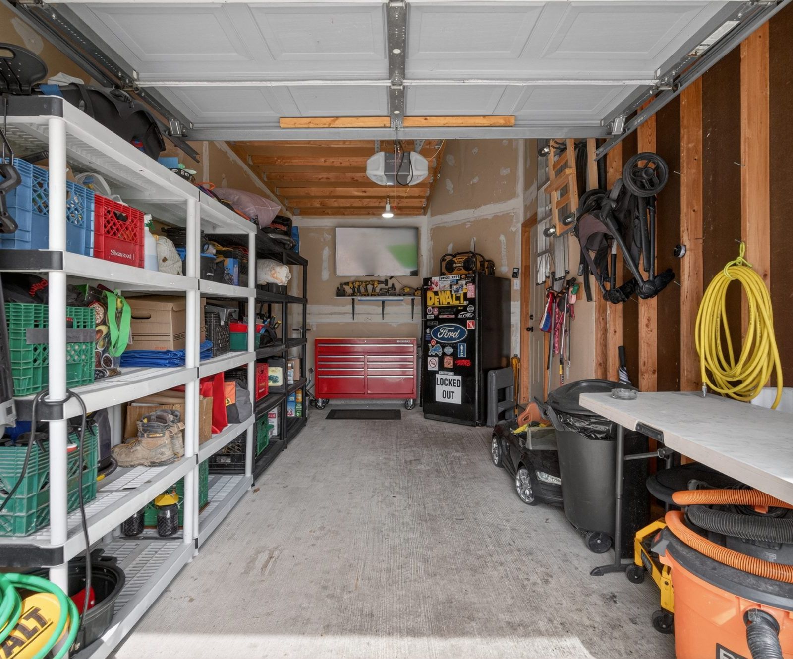 Organized garage with shelving and tools