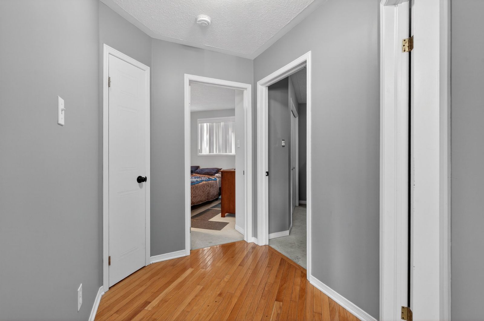 Upstairs hallway with hardwood floors