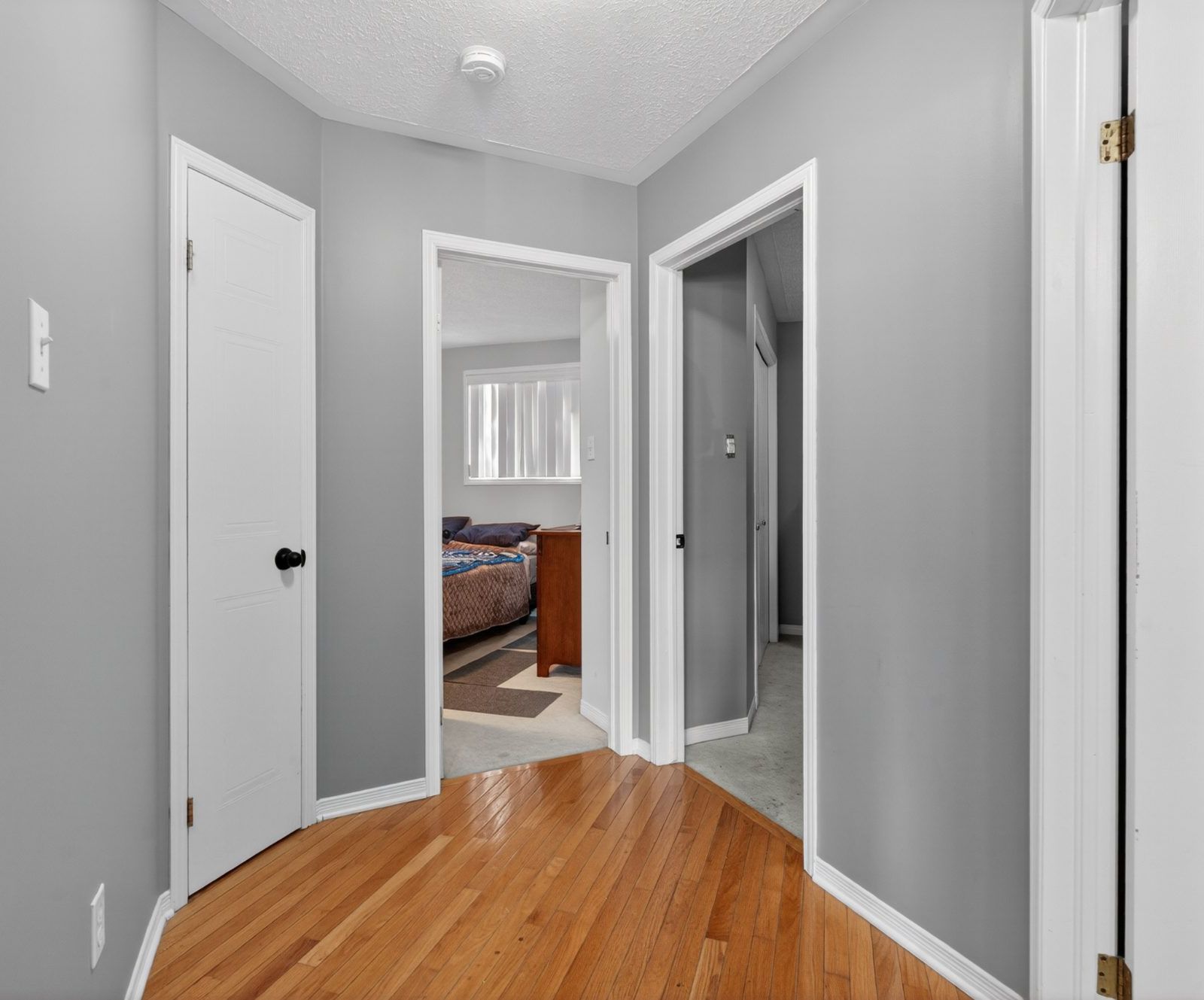 Upstairs hallway with hardwood floors
