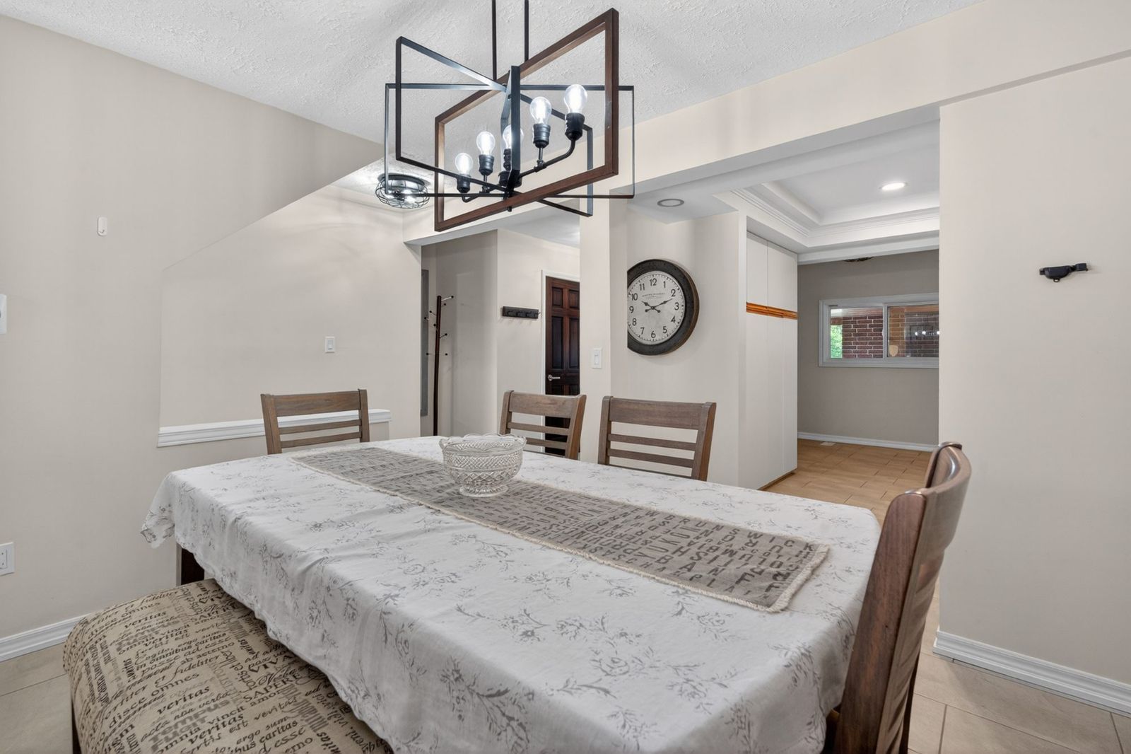 Dining room with geometric chandelier