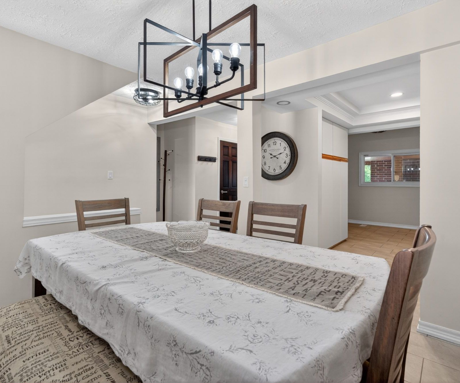 Dining room with geometric chandelier