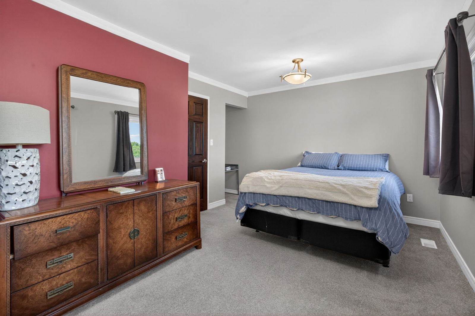 Second bedroom with window and dresser