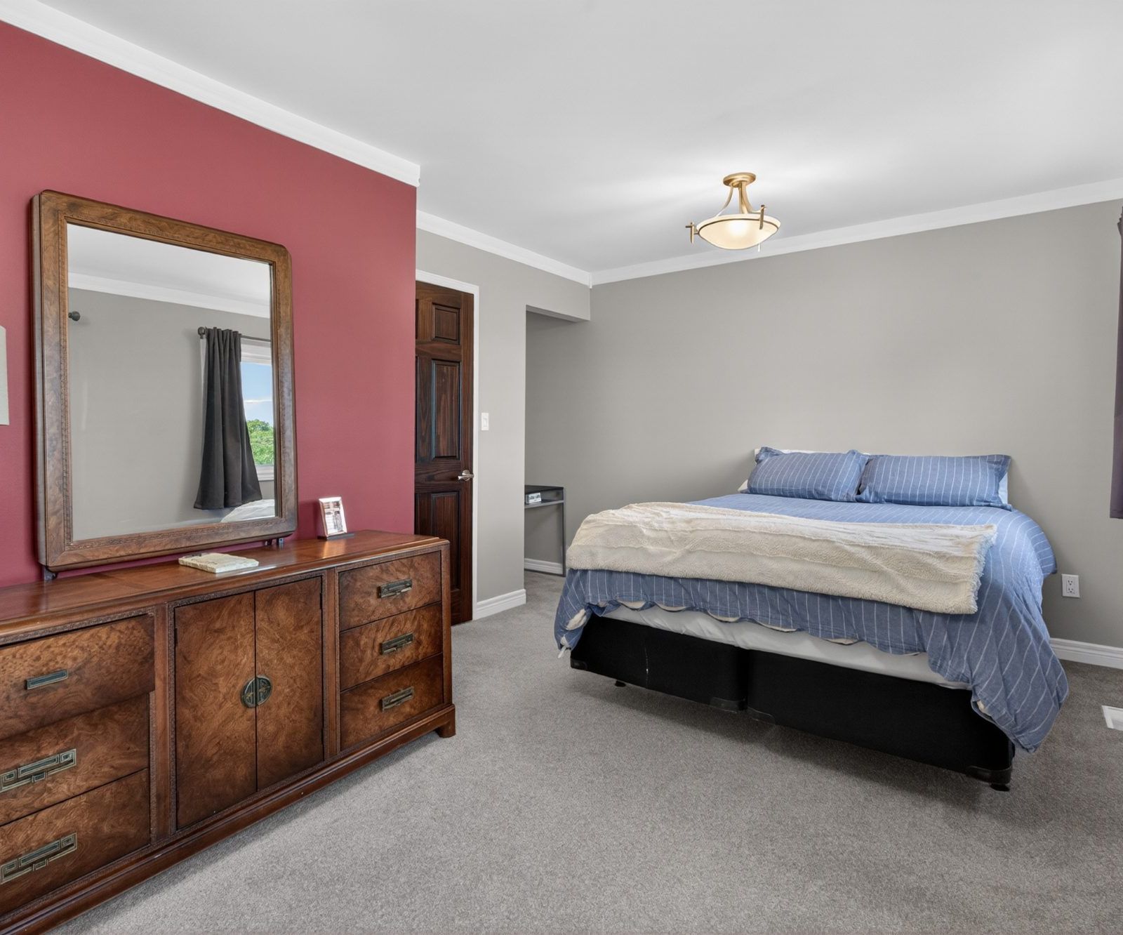 Second bedroom with window and dresser