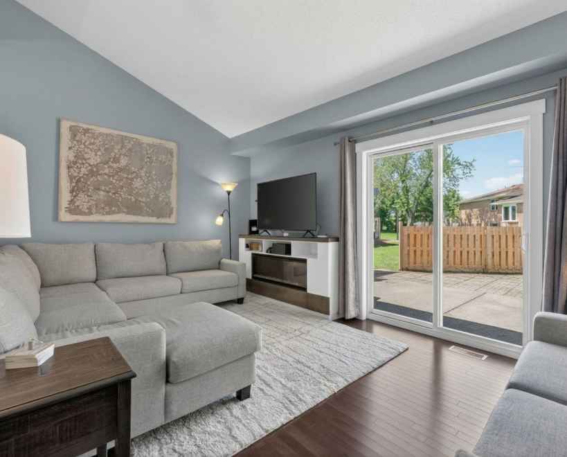 Living room with sliding patio door to fenced yard