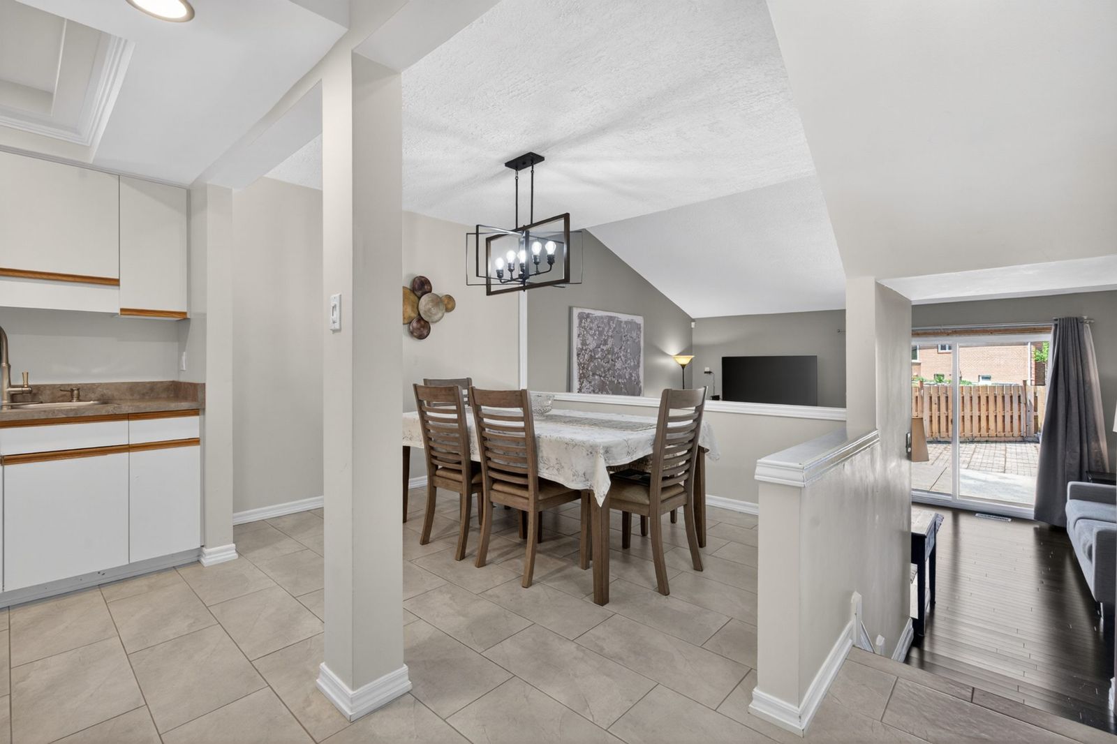 Dining area with chandelier and sliding patio door view