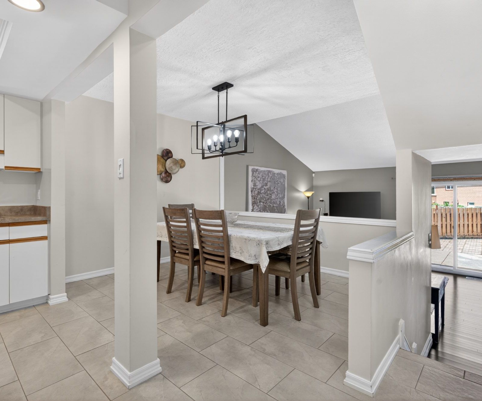 Dining area with chandelier and sliding patio door view