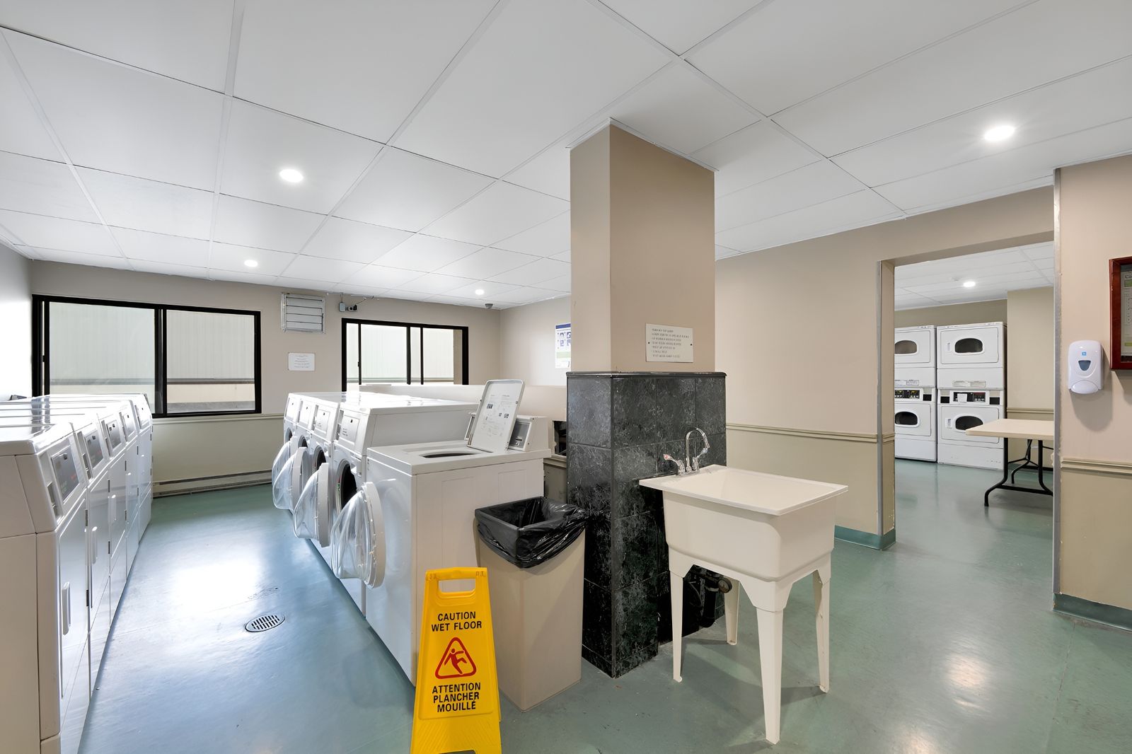 Laundry room with washers and dryers