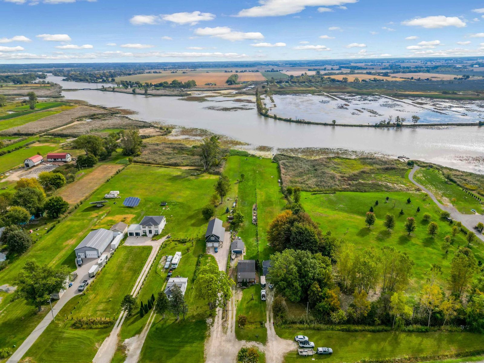 Aerial view of fields, properties and the canal.