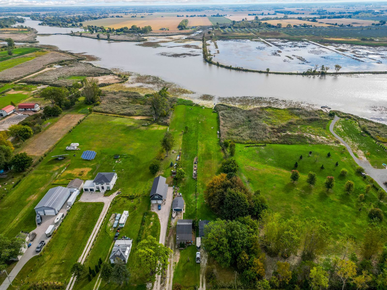 Aerial view of the lots along the canal, with the river beyond.