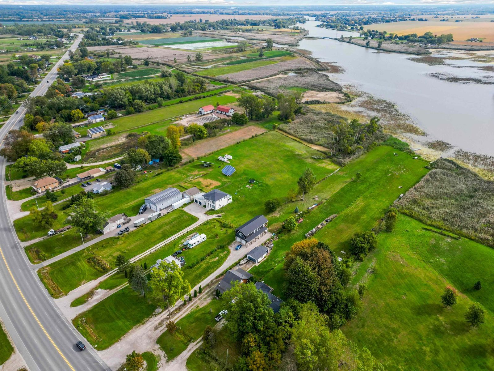 Aerial view of the neighbourhood, canal, roads and fields.