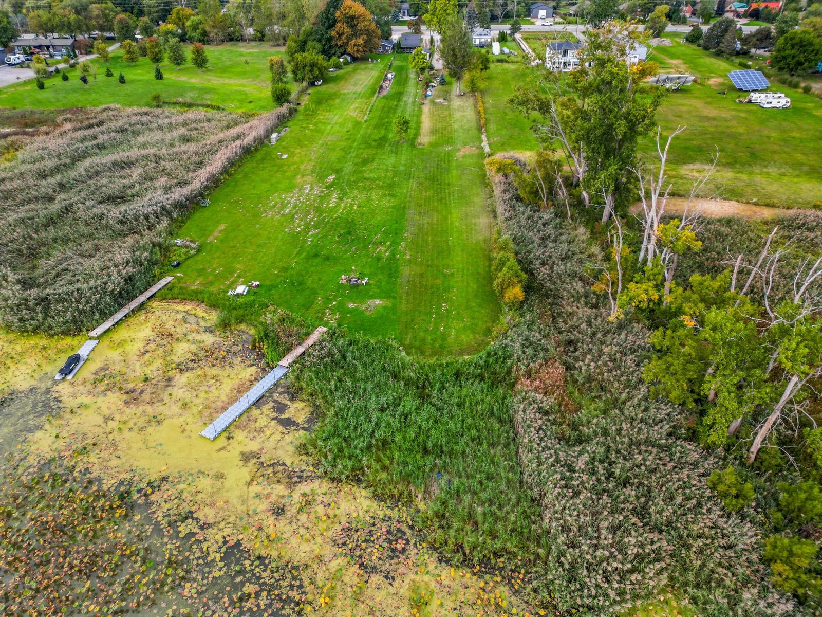 Aerial view of the lawn running down to the canal and docks.